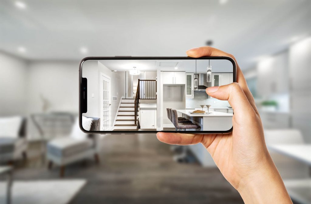 image of iPhone being held to capture photo of living room