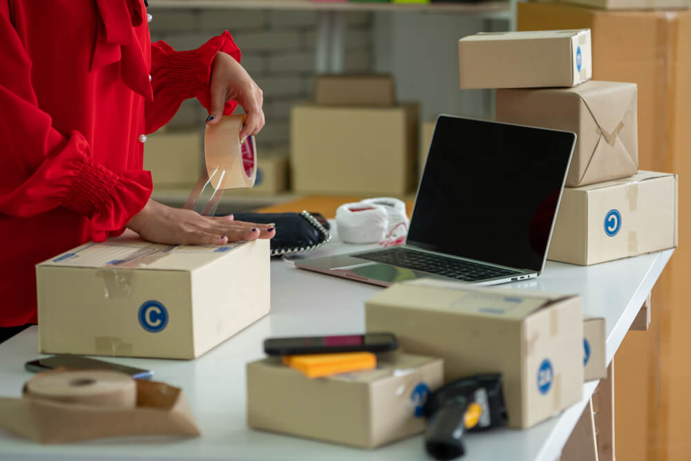woman packaging electronic media for a move