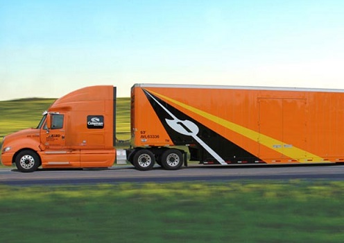 Allied Moving Van Lines orange-colored truck on an interstate highway