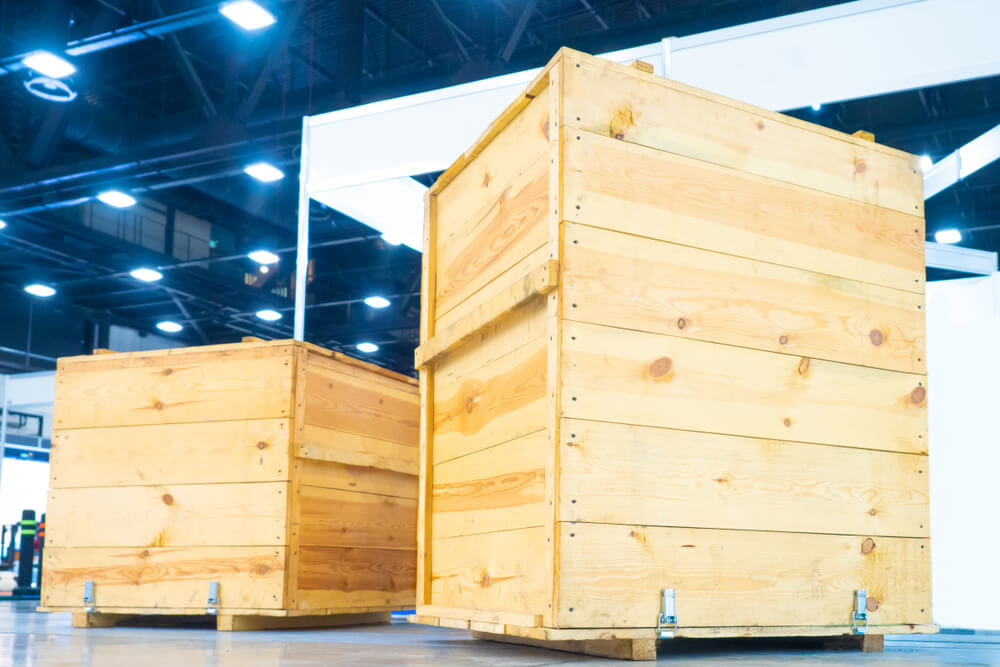 sturdy, wooden, box crates in a well lit warehouse